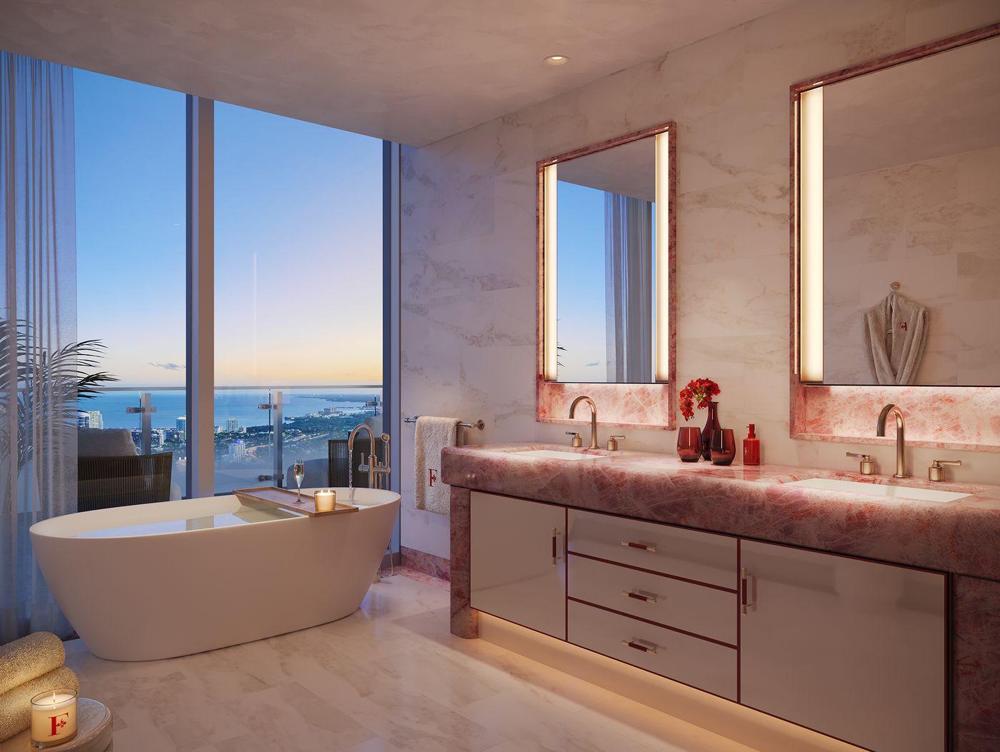 Primary bath with a freestanding tub at the window and a pink quartzite vanity