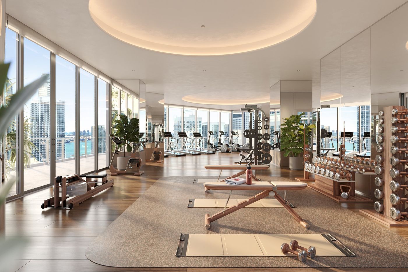 Fitness center in wood and white with views of the bay