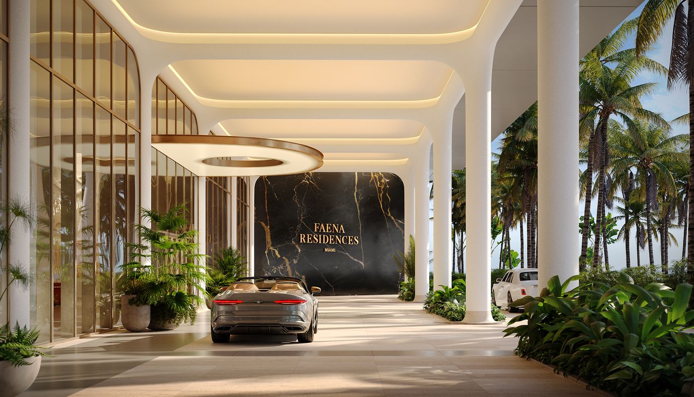 Covered porte cochère with sculpted white columns and a black marble wall