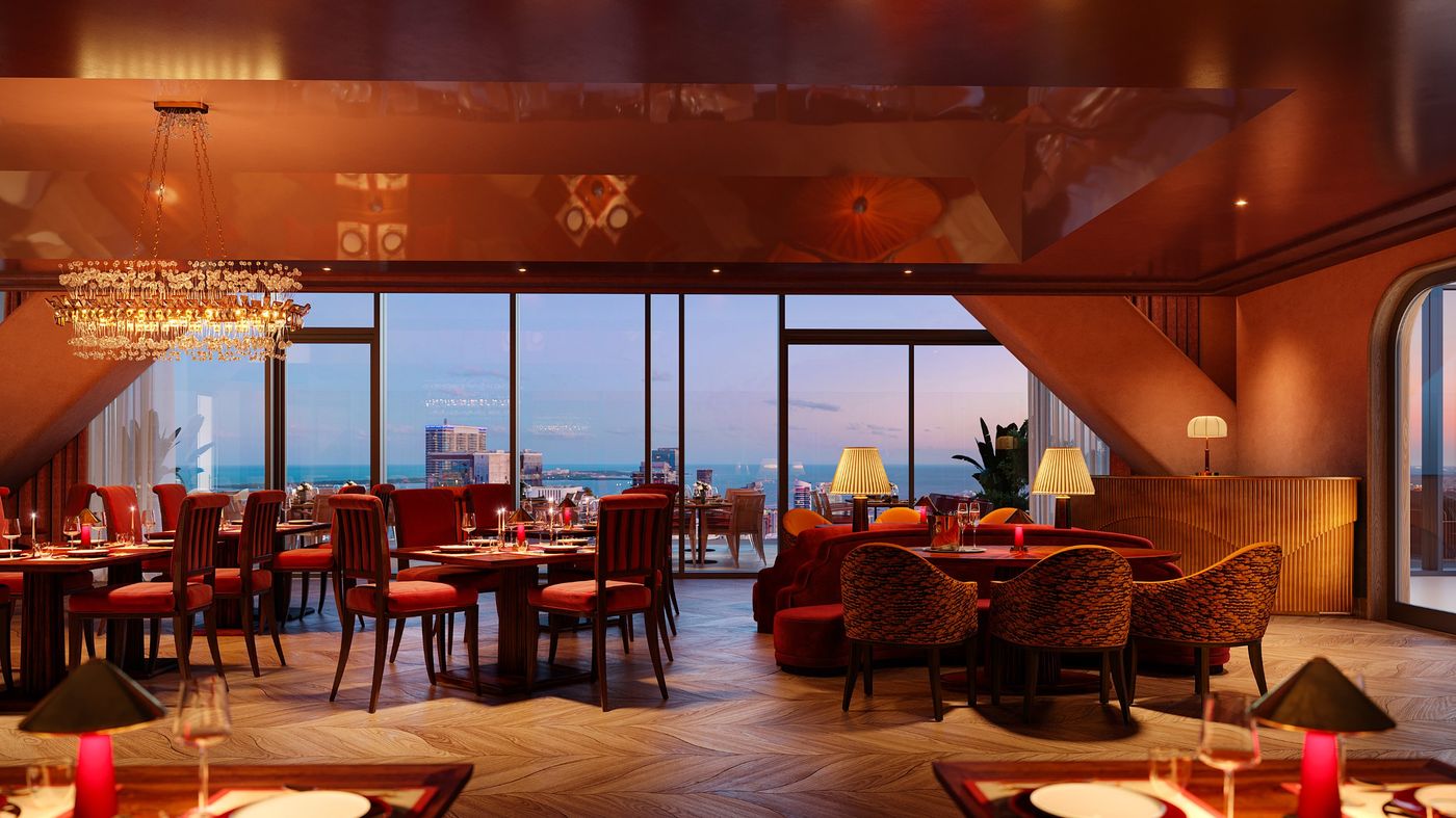 Dining room in red velvet and lacquer with views of the bay at dusk