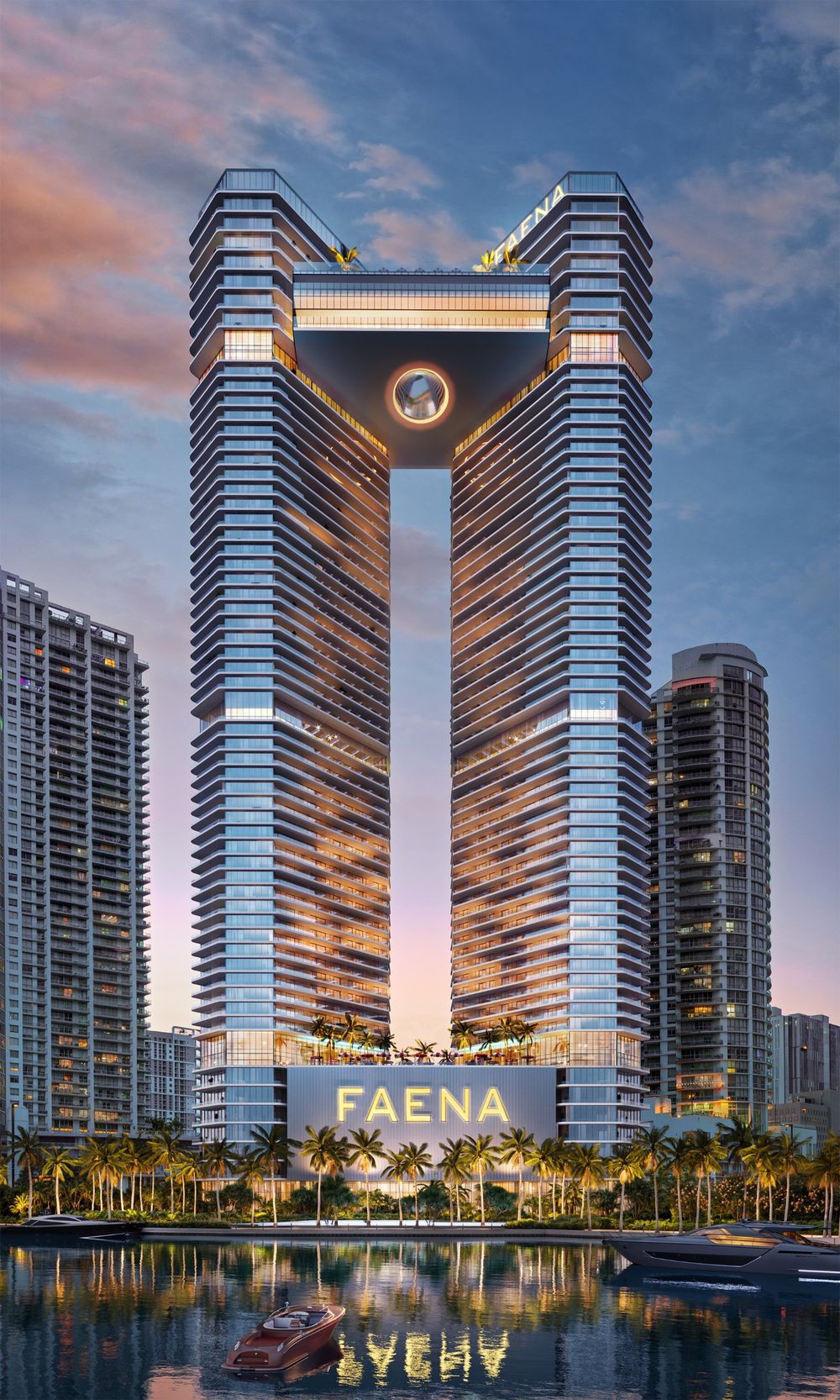 The two towers rising from the Miami River at dusk